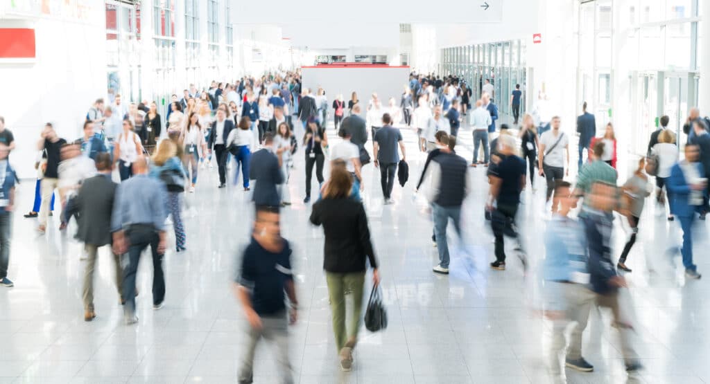 blurred business people at a trade fair